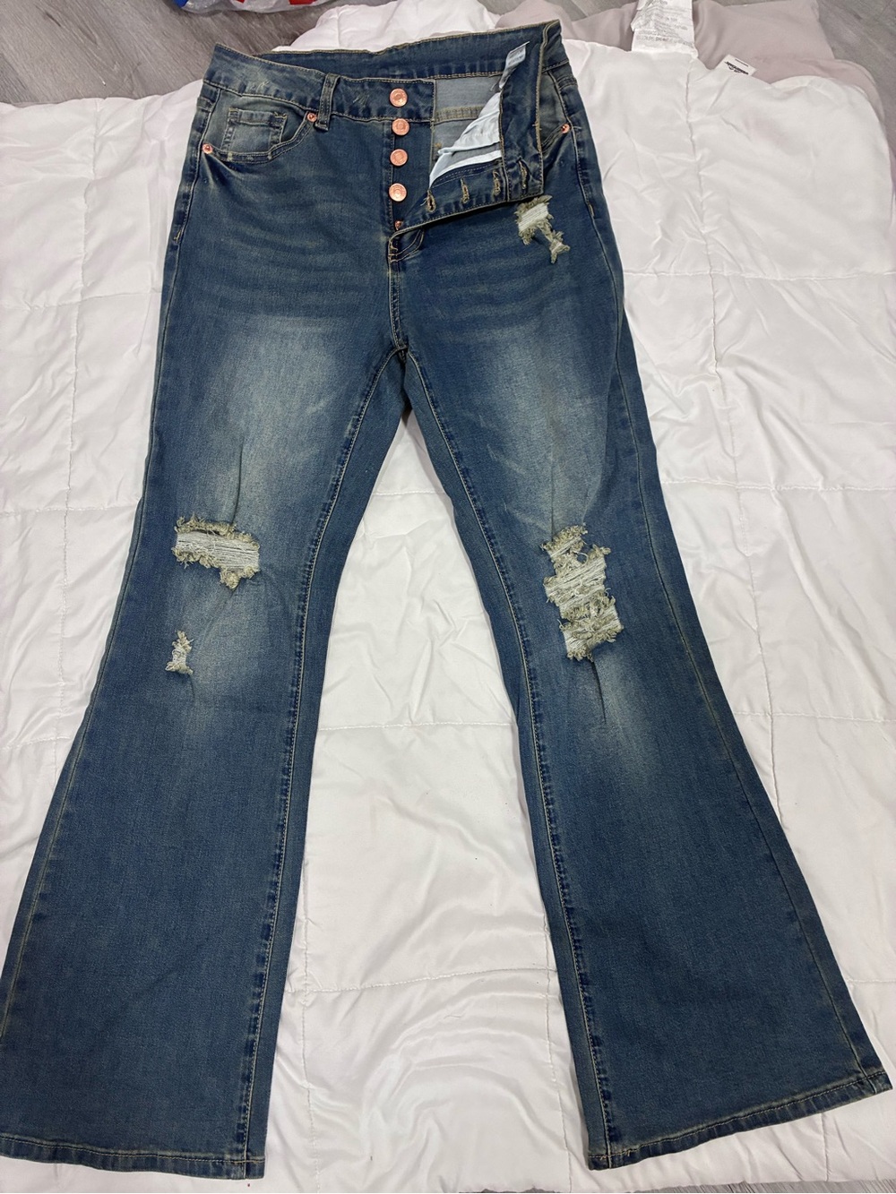High-Rise Distressed Flare Jeans in Medium Blue